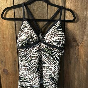 Athleta swim tank, black trim with white, brown, and green floral pattern